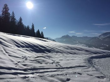 Scenic view of snow mountains against sky