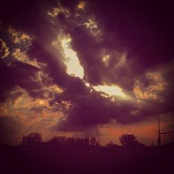 Scenic view of landscape against cloudy sky