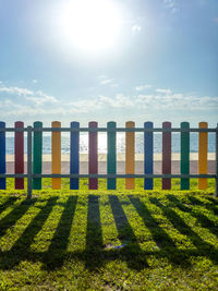 Scenic view of beach against sky on sunny day