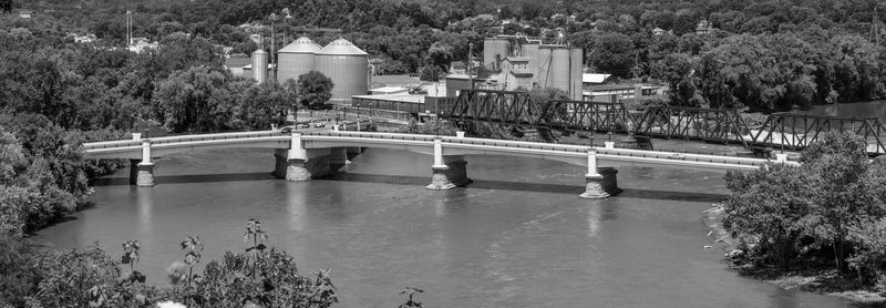 High angle view of footbridge over river in city