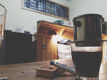 Close-up of coffee cup on table at home