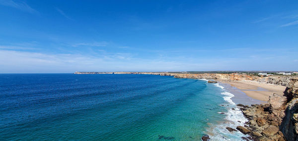 Scenic view of sea against blue sky