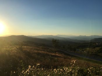 Scenic view of landscape against sky during sunset