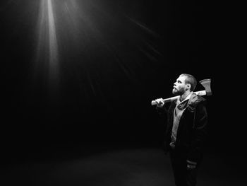 Low angle view of man standing at night