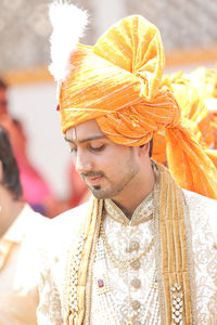 Portrait of young man with traditional clothing on his marriage