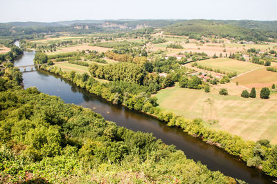 Scenic view of landscape by lake