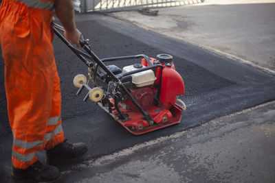 Man working on street in city