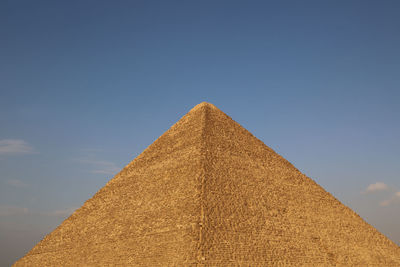 Low angle view of historical building against blue sky