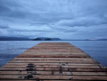 Pier over sea against sky