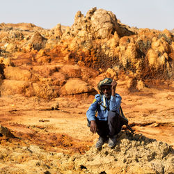 Man sitting on rock