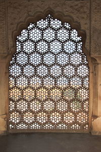 View of historic building seen through window