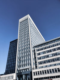 Low angle view of skyscraper against clear sky