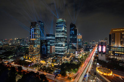 High angle view of illuminated buildings in city at night