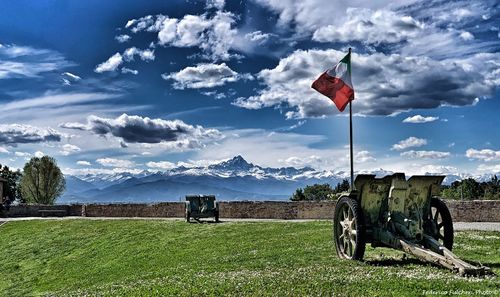 Flag on field against sky