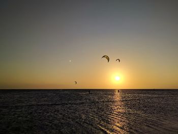 Scenic view of sea against clear sky during sunset