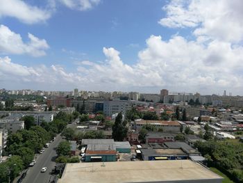 High angle view of buildings in city against sky