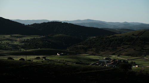 Scenic view of landscape and mountains against sky