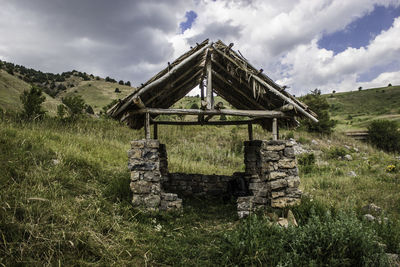 House on field against sky