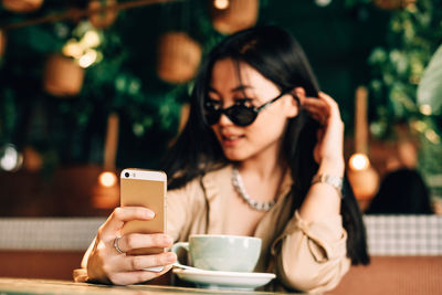 Young woman using smart phone