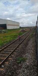 Train on railroad track against sky