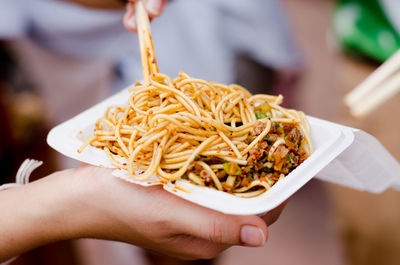 Midsection of person holding food