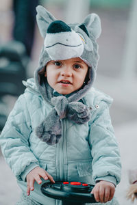 Portrait of cute baby girl in snow