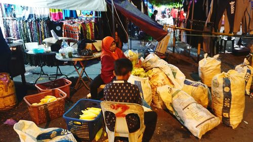 People at market stall