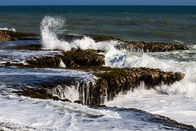 Waves splashing on wave in sea