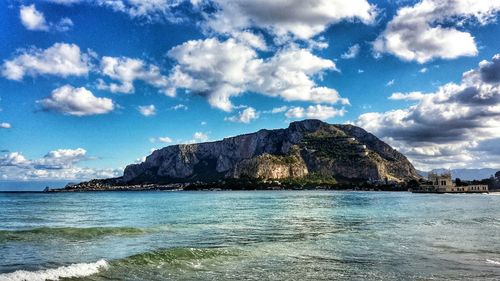 Scenic view of sea against cloudy sky