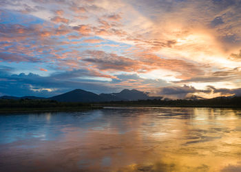 Scenic view of lake against sky during sunset