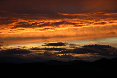 Scenic view of dramatic sky during sunset