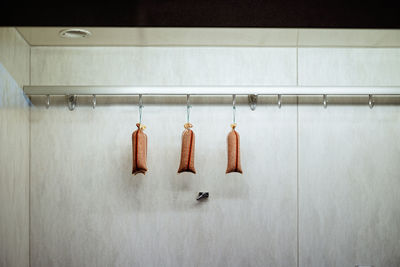 Sausages hanging on wall in market stall