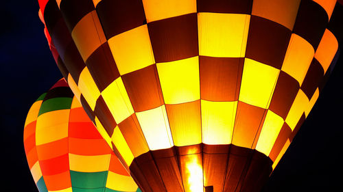 Low angle view of hot air balloon at night