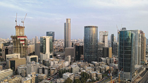 High angle view of buildings in city against sky