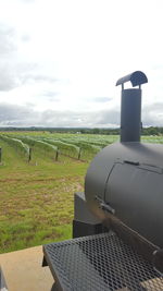 Windmill on field against sky