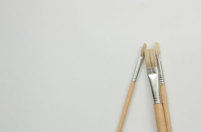 High angle view of pencils against white background