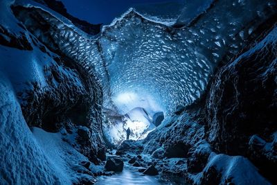 Person in frozen cave