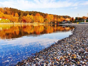 Scenic view of lake against sky during autumn