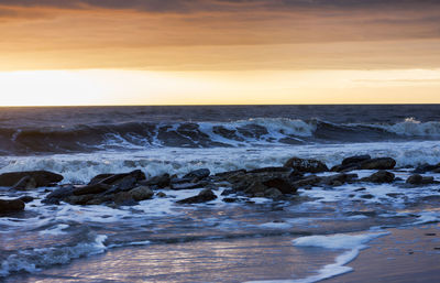 Scenic view of sea against sky during sunset