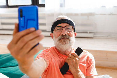 Portrait of man using mobile phone