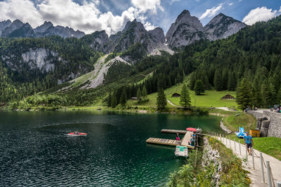 Scenic view of lake and mountains against sky