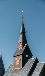 Low angle view of building against clear blue sky