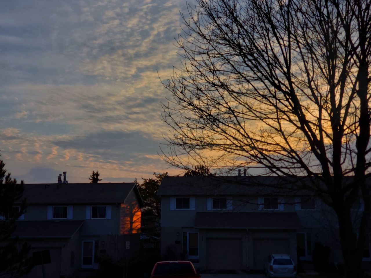 SILHOUETTE BUILDINGS AGAINST SKY DURING SUNSET