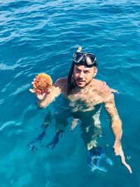 Portrait of man swimming in sea