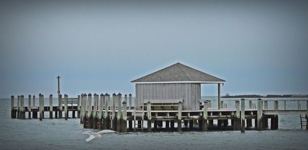 Lifeguard hut at beach against sky