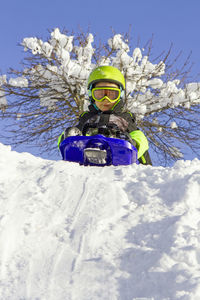 Man skiing on snow covered landscape