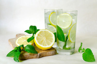 Lemons slices in drink on table