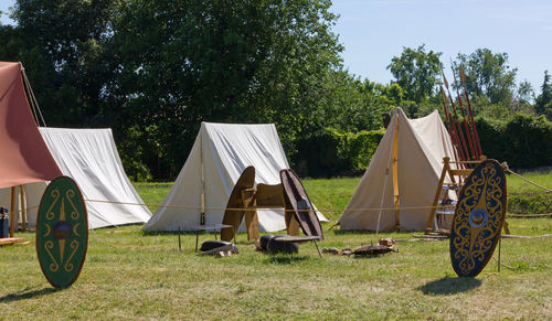 Tent on field against trees