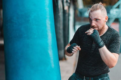 Young man boxing at gym