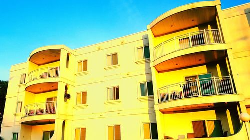 Low angle view of building against blue sky